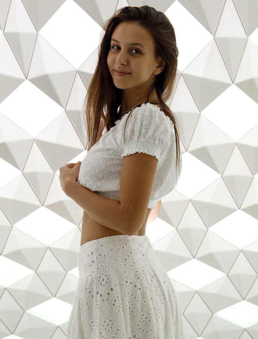 Jessica Albanka posing in a white skirt and white top-Zishy